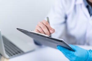 doctor making notes about cervical cancer