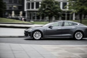 a grey car on the road a grey car on the road